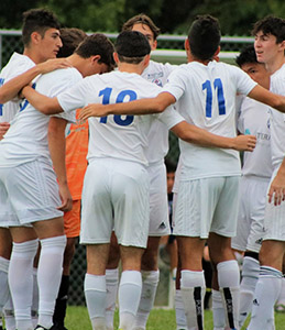 Players in a pre-game huddle.